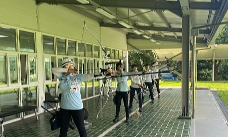 A photo of the Hyundai Department Store Archery Team members practicing. Photo Credit: Ria Ju