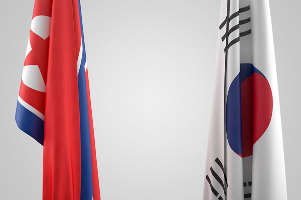 [North Korea and South Korea flags next to each other Photo credit: Pixabay]