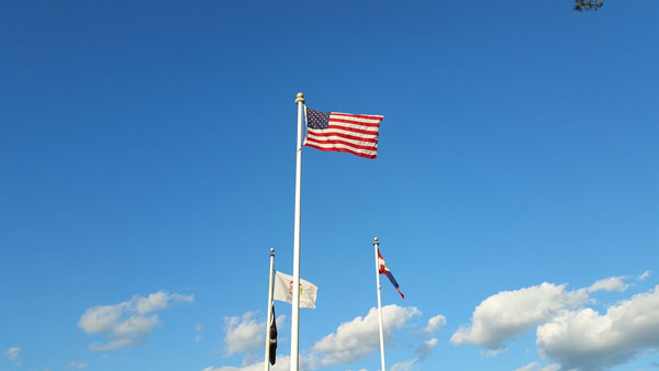 [United States flag in the sky. Photo Credit: Pixabay]
