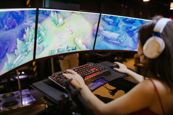 [A Woman Playing League of Legends. Photo Credit to Pexels]
