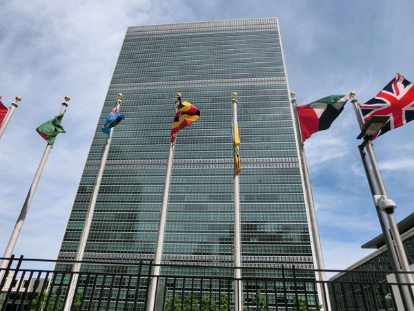 [Photo taken in front of the United Nations Headquarter in New York City, United States. Photo Credit to Pxhere]