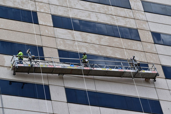 [Workers in seemingly precarious workplaces. Photo Credit to Pixabay]