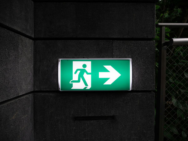 [Exit sign. Photo credit to Unsplash]